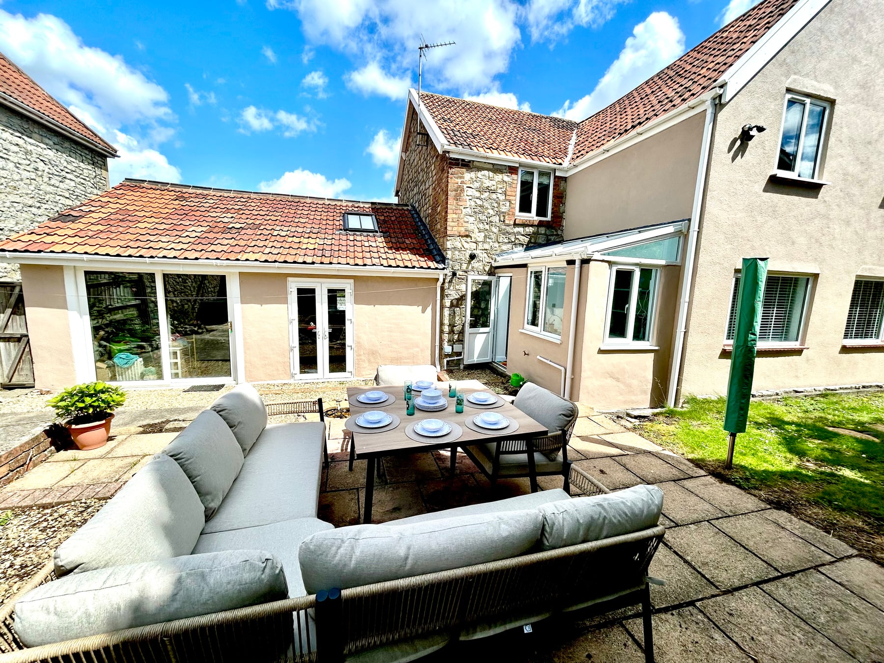 Wide view of the enclosed garden and outdoor dining area